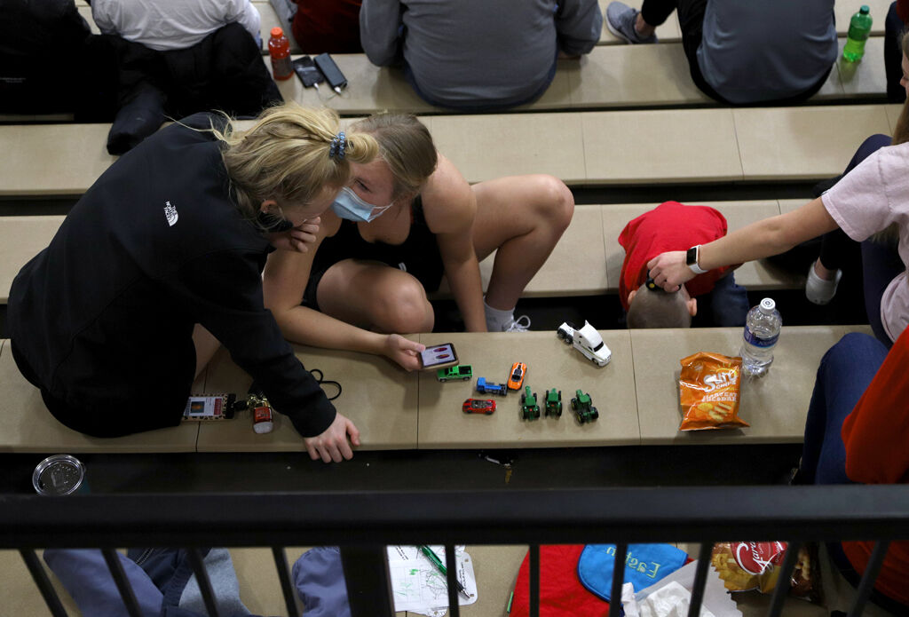 Sydney Fischer spends time with Harrisburg coach Ryan Richardson's family